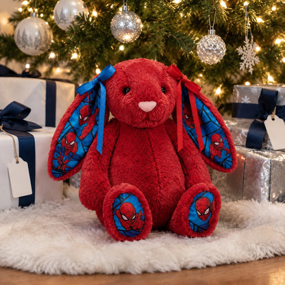 Holiday gift idea: red bunny plush with print ears under the Christmas tree