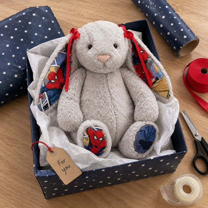 Holiday gift idea: grey bunny plush being gift wrapped with a For you tag