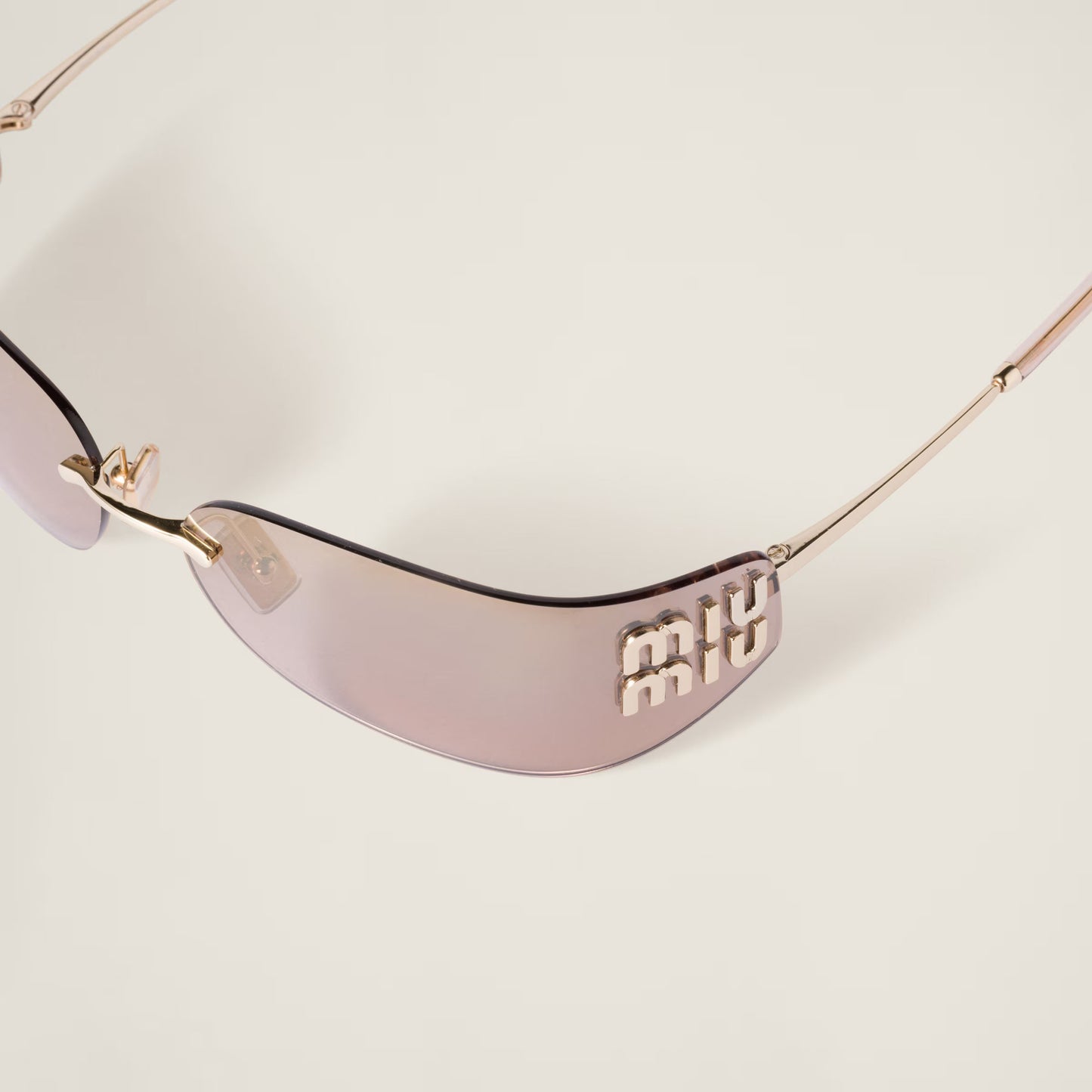 Side profile of the Aube Sunglasses showing the sculpted lens shape.