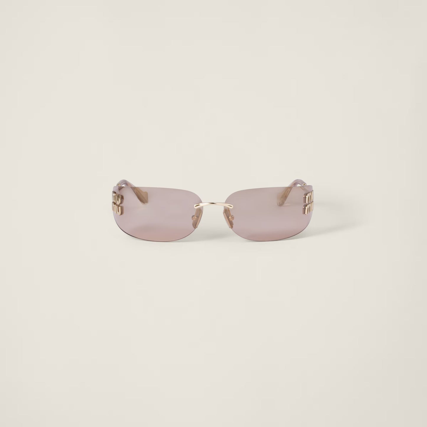 Aube Sunglasses with sculpted frame lines and refined gold detailing.