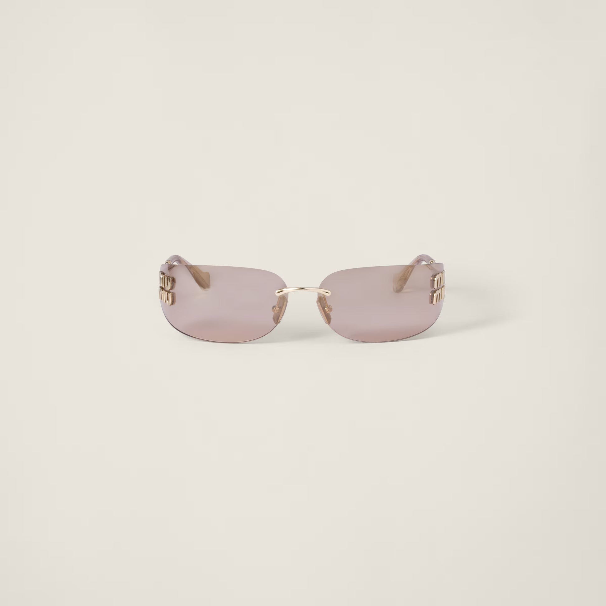 Aube Sunglasses with sculpted frame lines and refined gold detailing.