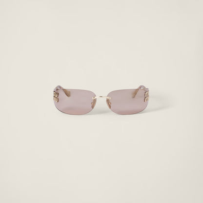 Aube Sunglasses with sculpted frame lines and refined gold detailing.