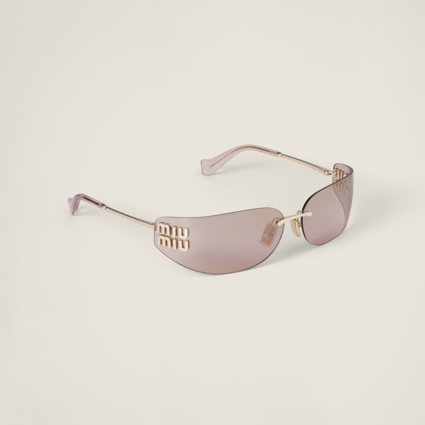 Close-up of the gold hardware detail on the Aube Sunglasses frame.